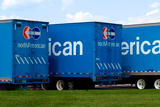 Three blue American trucks parked in a row, featured in the Winter Storage Guide for San Marcos Facilities.