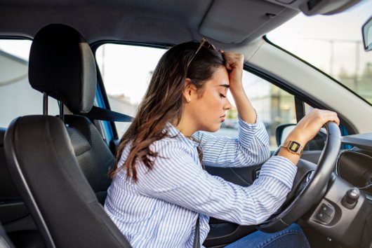 Stressed woman drive car feeling sad and angry. Asian girl tired, fatigue mental on car. Sleepy and drunk female hangover. Illegal law driver license. Driving when tired and dont drive drowsy concept