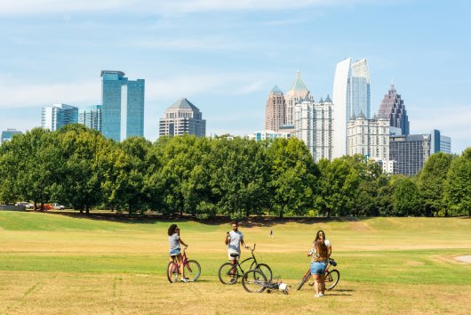 Atlanta, Georgia, United States of America September 27, 2016. View of the the Midtown Skyline in Atlanta, GA, from the Piedmont Park, with people in the foreground.