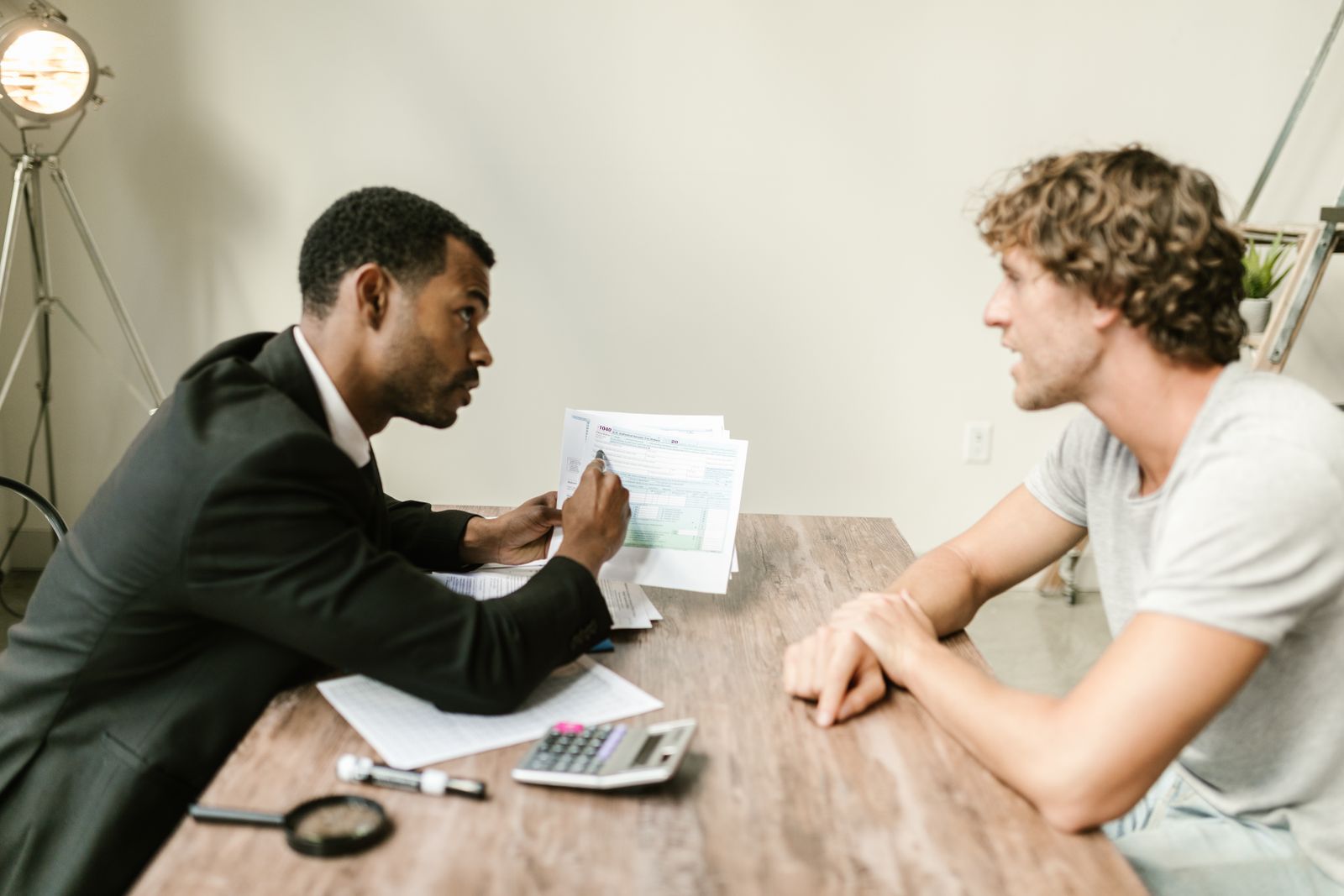 An advisor talking through paperwork with a client